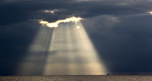 Crepuscular rays at Lutong Beach